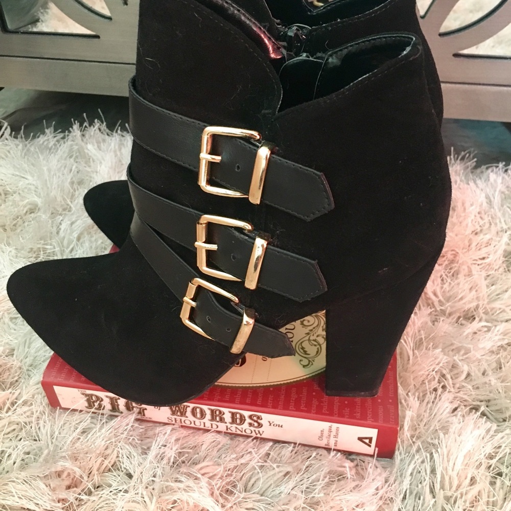 Steve Madden booties with Gold Buckles.